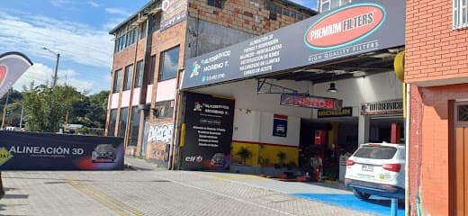 AUTOSERVICIO MORENO T. Alineación - Balanceo - Frenos - suspensión - Montallantas - cambio de aceite - rectificación de rines — foto